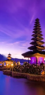 Bali temple against a vibrant purple dusk sky.