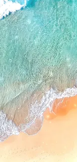 Aerial view of a tranquil turquoise ocean meeting a sandy beach.