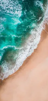 Aerial beach view with turquoise waves and sandy shore.