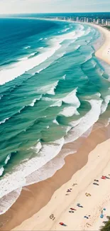 Aerial view of a vibrant beach with turquoise waves and sandy shores.