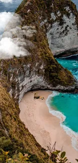 Aerial view of turquoise ocean and cliffs on a serene beach.