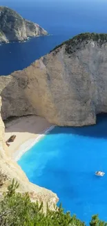 Mobile wallpaper of a beach with blue ocean and cliffs.