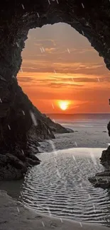 A breathtaking sunset seen through a beach rock archway, reflecting on the sand.