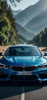 Sleek blue car on a scenic mountain road.