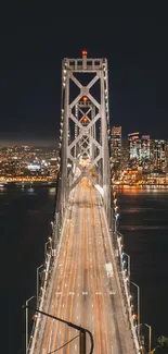 Night view of a bridge with a city skyline in the background, creating a captivating scene.