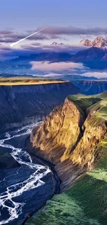 A stunning canyon with a winding river, green landscapes, and mountains in the distance.