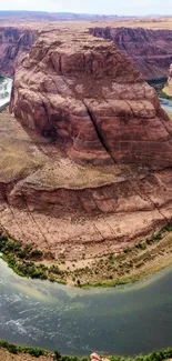 Breathtaking view of a winding river through a canyon with vivid colors.