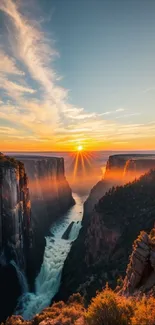Sunset over canyon with waterfall, vibrant colors and dramatic cliffs.
