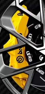 Detailed silver and yellow car wheel design close-up wallpaper.
