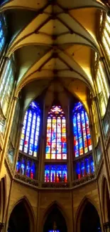 Cathedral interior with vibrant stained glass windows.