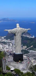 Christ the Redeemer statue above Rio, vibrant blue sky.