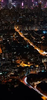 City skyline at night with vibrant lights.