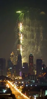 Night city skyline with fireworks lighting up the sky.