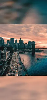 Mobile wallpaper of a city skyline at sunset with vibrant warm orange hues.