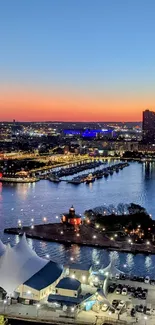 Evening cityscape with sunset colors reflecting on the water.