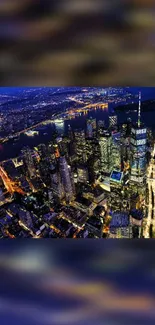 Aerial view of a cityscape at night with vibrant lights.