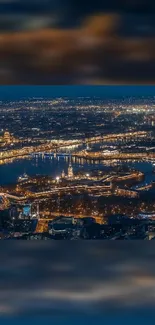 Night cityscape with sparkling river and skyline lights.