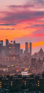 A stunning cityscape at sunset with a vibrant orange sky.