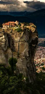 Monastery on a cliff with dramatic sky backdrop.