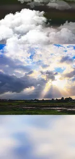 Mobile wallpaper featuring a vibrant sky with clouds and sun rays over a lush landscape.