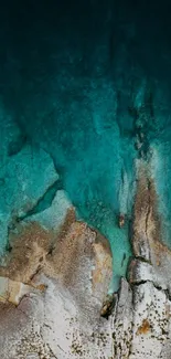 Aerial view of turquoise blue ocean and rugged coastline.