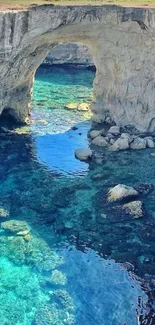 Scenic coastal rock arch over blue water.