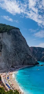 Stunning beach with turquoise ocean and dramatic cliffs.