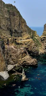 Stunning coastal cliff against deep blue sea.