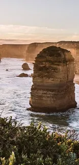 Stunning view of coastal cliffs and ocean waves at sunrise.