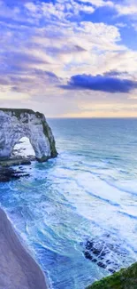 A stunning coastal cliff with a vibrant blue ocean and sky.