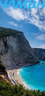 A stunning cliffside beach with blue skies and turquoise ocean waters.