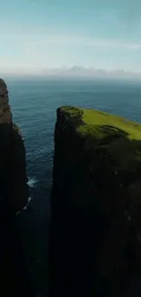 Stunning coastal cliff against the ocean backdrop, with lush green landscape.