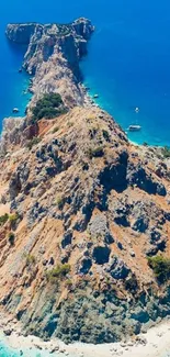 A stunning aerial view of an island with turquoise waters and a rocky coastline.