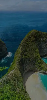 Scenic view of a coastal cliff with turquoise ocean waves and sandy beach.