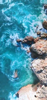 Turquoise ocean waves crash against rocky cliffs in a coastal scene.