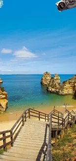 Beach cliffscape with ocean and wooden stairs.