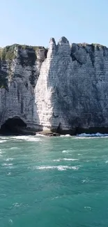 Majestic Etretat cliffs with turquoise sea.