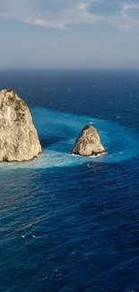 Stunning coastal view with blue ocean and rugged cliffs.