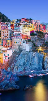 Colorful coastal village at dusk with vibrant reflections.