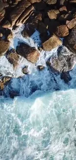 Aerial view of ocean waves crashing against rocky coastline.