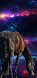 A horse grazes under a vibrant and colorful cosmic sky in this stunning wallpaper.