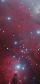 A deep red nebula with stars scattered across the galaxy, perfect for mobile wallpaper.