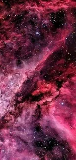 Vibrant pink and purple cosmic nebula wallpaper.