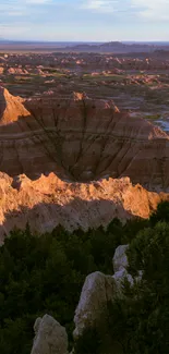 Mobile wallpaper of desert cliffs at sunset with natural hues.