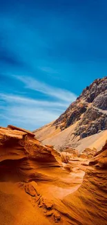 Stunning desert landscape with blue sky and orange dunes.