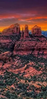 Breathtaking desert sunset with colorful sky and rocky landscape.