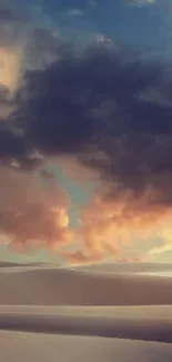 Desert sunset with vibrant clouds over sand dunes.