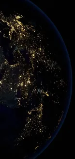 Night view of Earth from space, emphasizing city lights and geography.