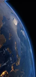 A stunning view of Earth from space, showcasing illuminated cities and vibrant colors.