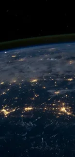 Earth from space showcasing dazzling city lights against a dark backdrop.